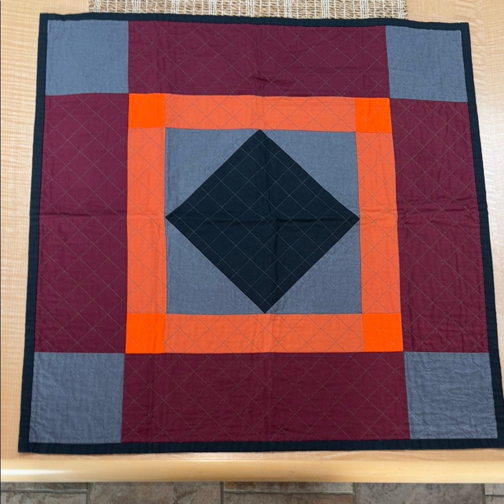 Homemade Geometric Patchwork Quilt in Orange, Gray, and Black